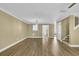 Open concept living space with hardwood floors and access to a patio or deck through glass doors at 2008 Falcon Glen Ct, Alpharetta, GA 30022