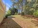 Spacious backyard with mature trees providing shade and a patio perfect for outdoor entertaining at 2907 Clearbrook Dr, Marietta, GA 30068