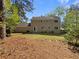 Large backyard providing ample space for outdoor activities, featuring mature trees at 2907 Clearbrook Dr, Marietta, GA 30068