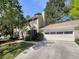 Charming two-story home with a two-car garage, landscaped front yard, and mature trees at 2907 Clearbrook Dr, Marietta, GA 30068