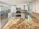 Well-equipped kitchen with stainless steel appliances, granite countertops, and white cabinetry at 2907 Clearbrook Dr, Marietta, GA 30068