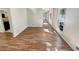 Inviting living space showcasing wood-look floors and neutral walls, with views into the kitchen at 2907 Clearbrook Dr, Marietta, GA 30068