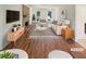 Bright living room featuring a brick fireplace, wood floors, and stylish, modern furniture at 2907 Clearbrook Dr, Marietta, GA 30068