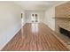 A sun-filled living room features wood-look floors, a cozy fireplace and access to the backyard at 2907 Clearbrook Dr, Marietta, GA 30068