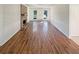 Open-concept living room showcasing wood flooring, brick fireplace, and neutral walls at 2907 Clearbrook Dr, Marietta, GA 30068