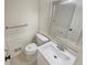 This well-lit powder room offers modern fixtures, including a sink and toilet at 2907 Clearbrook Dr, Marietta, GA 30068