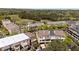 Aerial view of a neighborhood of townhomes adjacent to a golf course at 3105 Neal Ct, Cumming, GA 30041