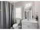 Clean bathroom includes shower, vanity with sink, toilet, and mirror at 3105 Neal Ct, Cumming, GA 30041