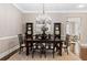 Dining room featuring a chandelier, large table, and decorative cabinets at 3105 Neal Ct, Cumming, GA 30041