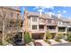 Elegant townhome showing the garage, multiple balconies, and brick and siding details at 3105 Neal Ct, Cumming, GA 30041