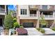 Charming townhome with a two-car garage, balcony, and landscaped front yard at 3105 Neal Ct, Cumming, GA 30041