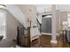 Foyer with hardwood floors, staircase, and a stylish console table at 3105 Neal Ct, Cumming, GA 30041