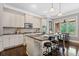 Gourmet kitchen featuring granite countertops, stainless steel appliances, and a spacious island with bar seating at 3105 Neal Ct, Cumming, GA 30041