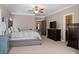 Spacious main bedroom featuring a large bed, TV, and ensuite bathroom at 3105 Neal Ct, Cumming, GA 30041