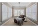 Sunroom with large windows, comfortable seating, and plenty of natural light at 3105 Neal Ct, Cumming, GA 30041