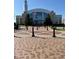 Exterior shot of the city hall, showcasing its architectural design and surrounding landscape and brick walkway at 320 Town Center Ave # U206B, Suwanee, GA 30024