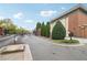 View of the gated entrance into the residential community under a partly cloudy sky at 320 Town Center Ave # U206B, Suwanee, GA 30024