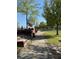 Paved walkway through a community green, lined with trees and landscaping with brick accent features at 320 Town Center Ave # U206B, Suwanee, GA 30024