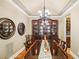 Formal dining room featuring a large table, china cabinet, and elegant decor at 320 Town Center Ave # U206B, Suwanee, GA 30024
