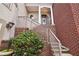 Brick entryway to home featuring a staircase leading to the front door at 320 Town Center Ave # U206B, Suwanee, GA 30024