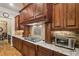 Well-equipped kitchen features granite countertops, stainless steel appliances, and plenty of cabinet space at 320 Town Center Ave # U206B, Suwanee, GA 30024