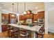 Gourmet kitchen with a large island, granite countertops, stainless steel appliances, and custom cabinetry at 320 Town Center Ave # U206B, Suwanee, GA 30024