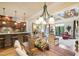 Open concept living space with wood floors, a modern kitchen, and a living room with a fireplace at 320 Town Center Ave # U206B, Suwanee, GA 30024