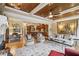 Spacious living room featuring an open concept design, hardwood floors, and custom ceilings at 320 Town Center Ave # U206B, Suwanee, GA 30024