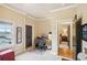 Office with a desk, cabinets, window, and view of a room with a bed in the background at 320 Town Center Ave # U206B, Suwanee, GA 30024