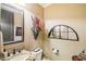 Elegant powder room with decorative mirror, granite countertop and beautiful wall decor at 320 Town Center Ave # U206B, Suwanee, GA 30024