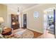 Relaxing sitting room features a charming oval window and ample natural light at 320 Town Center Ave # U206B, Suwanee, GA 30024