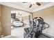 Bright bedroom suite with workout equipment including treadmill and elliptical at 320 Town Center Ave # U206B, Suwanee, GA 30024