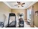 Bedroom with workout equipment including treadmill, elliptical and free weights at 320 Town Center Ave # U206B, Suwanee, GA 30024