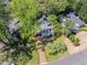 Aerial view of the home, featuring a brick driveway, mature trees, and well-manicured landscaping at 3860 Carlton Dr, Atlanta, GA 30341