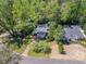 A sprawling estate nestled amongst mature trees with brick walkway and lush landscaping at 3860 Carlton Dr, Atlanta, GA 30341
