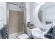 Bathroom with a glass shower, sink, mirror and beige tile surround at 3860 Carlton Dr, Atlanta, GA 30341
