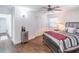 Bright bedroom with hardwood floors, ceiling fan, closet and a modern grey bed at 3860 Carlton Dr, Atlanta, GA 30341