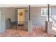 Front porch with yellow front door and wrought iron seating at 3860 Carlton Dr, Atlanta, GA 30341