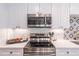 Well-equipped kitchen features modern appliances, stylish backsplash, and ample counter space at 3860 Carlton Dr, Atlanta, GA 30341