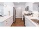 Modern kitchen features stainless steel appliances, white cabinetry, and sleek countertops at 3860 Carlton Dr, Atlanta, GA 30341