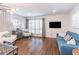 Bright living room with hardwood floors, wainscotting and modern furnishings at 3860 Carlton Dr, Atlanta, GA 30341