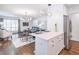 Open-concept living space with kitchen island, dining area, and bright living room at 3860 Carlton Dr, Atlanta, GA 30341