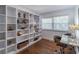 Study with built-in shelving, hardwood floors, contemporary desk and natural light at 3860 Carlton Dr, Atlanta, GA 30341