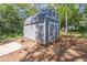 Storage shed with wood-finish exterior and access door at 3860 Carlton Dr, Atlanta, GA 30341