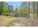 Expansive backyard features mature trees, sprawling lawn, and inviting outdoor space at 1855 Mountain Trce, Canton, GA 30114