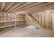 Unfinished basement with wooden walls, concrete floor, and installed shelving, ready for personalization at 1855 Mountain Trce, Canton, GA 30114