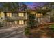 Charming two-story home with a covered porch, attached garage, and lush landscaping at 1855 Mountain Trce, Canton, GA 30114