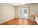 Bright room featuring hardwood floors and glass doors leading to the outdoors at 1855 Mountain Trce, Canton, GA 30114