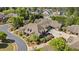 An aerial view of luxury homes with beautiful landscaping in a well-maintained neighborhood with mature trees at 2550 Ballantrae Cir, Cumming, GA 30041