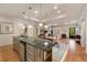 Elegant kitchen with granite countertops, stainless steel appliances and an open layout connecting to other living areas at 2550 Ballantrae Cir, Cumming, GA 30041